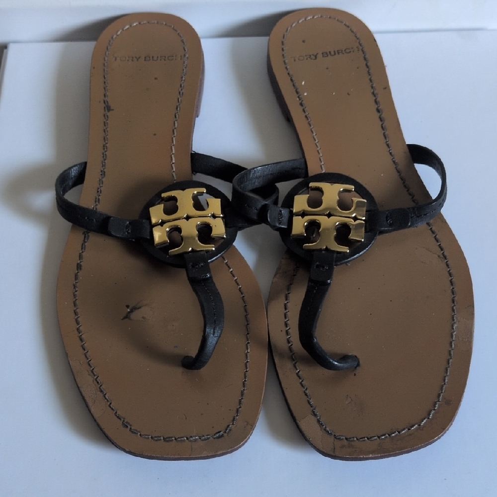 Tory Burch Black and Tan Sandals with Gold Medallion
